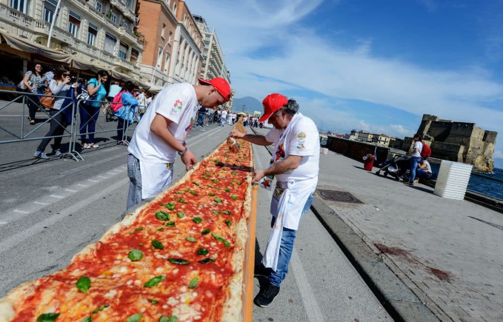 For their wedding, they serve a giant pizza to their guests, good or bad idea